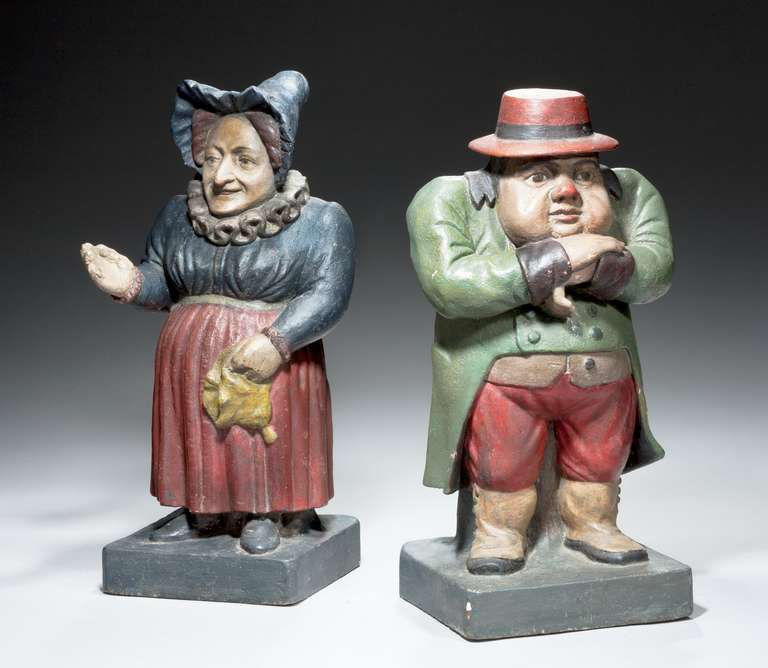 Pair of amusing mid-19th century polychrome figures, with largely original decoration.