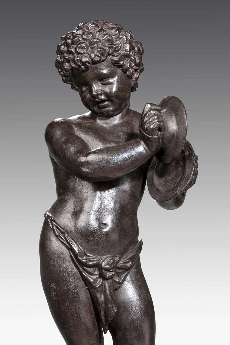 English Bronze Patinated Cast Iron Figure of a Putti For Sale