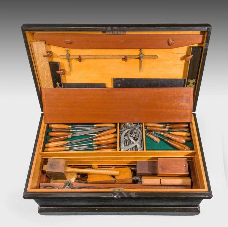 A truly wonderful and complete early 20th century cabinetmakers fitted wooden box, comprising wheel braces, oil stones, moulding and concave planes, spoke shave, mallets, sliding bevels, chisels, dividers, knives and slotted screw drivers and all