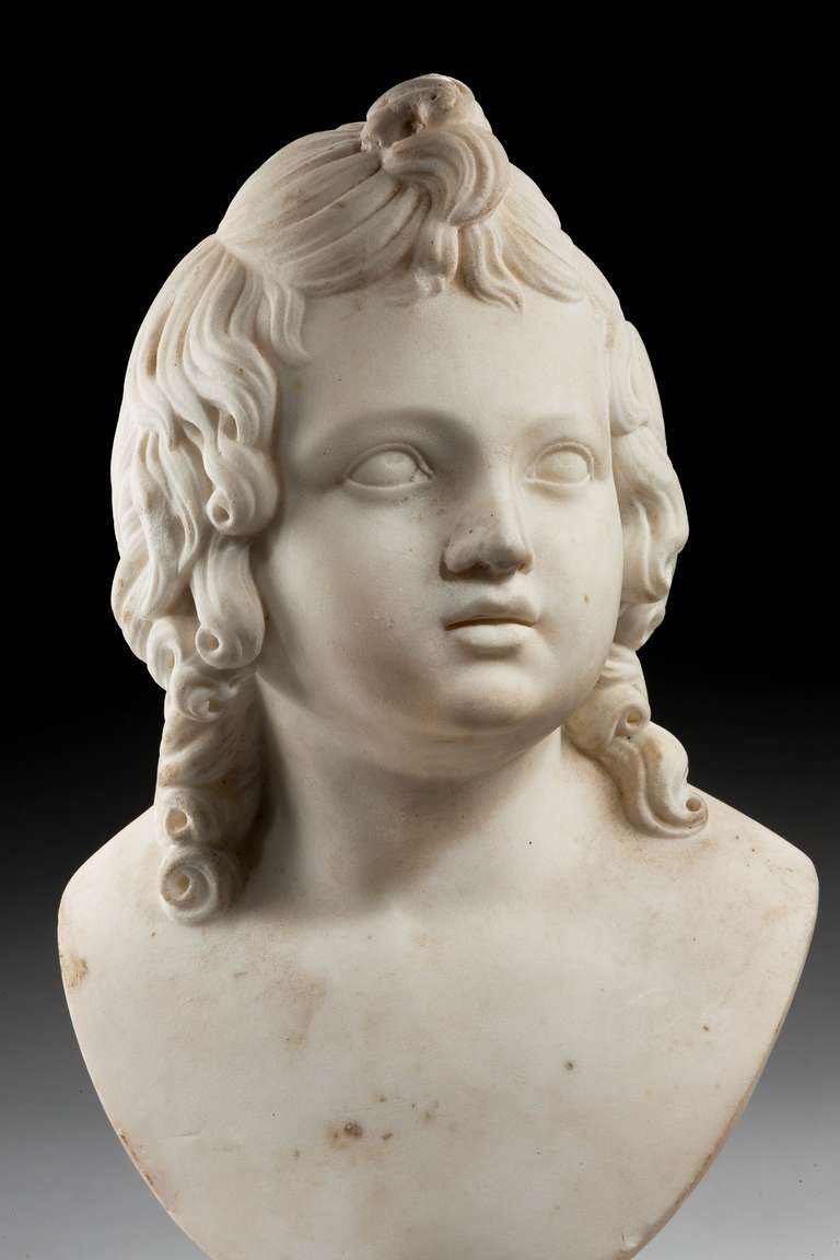 Well carved mid-17th century marble bust of a girl on a replaced socle.