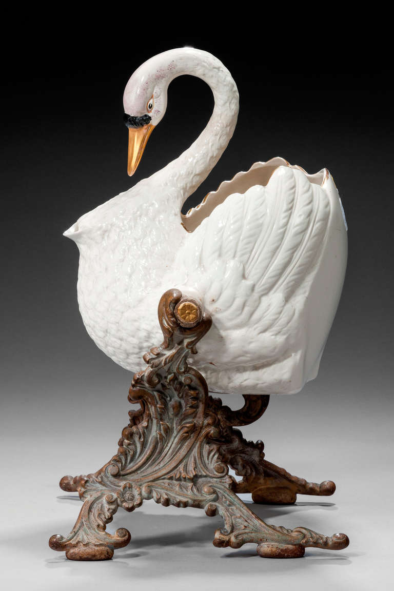 Staffordshire pottery swan drinks dispenser tilting to pour on a cast Rococo base. English patent 14865, Dunne and Company, Burslem.