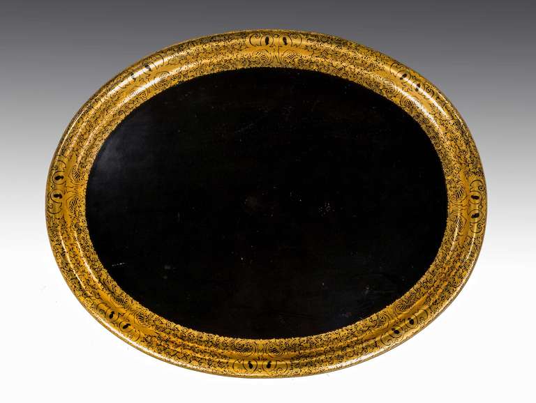 A large, oval papier mâché tray, black laquered background with very well executed and complex gilded scroll work.

Provenance:
Starting around 1725 in Europe, gilded papier mâché began to appear as a low-cost alternative to similarly treated