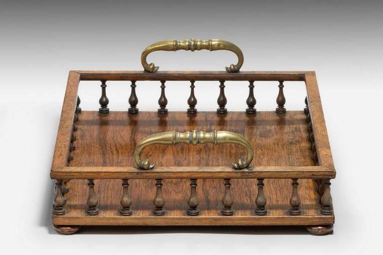 Regency period Book Tray retaining original gilt bronze carrying handles, the central body of finely turned baluster shape supports.

RR