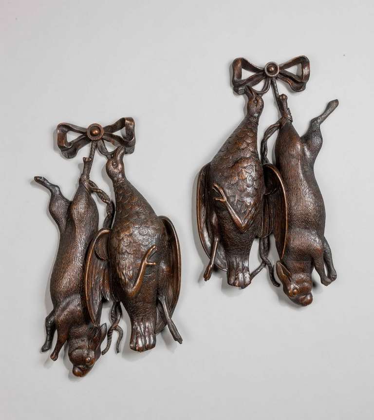 Pair of well carved late 19th century trophies, probably made in Switzerland, the matched pair of a rabbit and a game bird with excellently carved patinated surfaces.