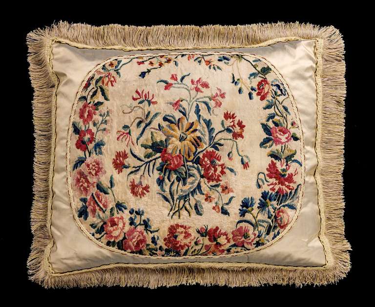 Gobelin, late 18th century wool with silk highlights. The central bouquet of foliage in a continuous border.

RR.