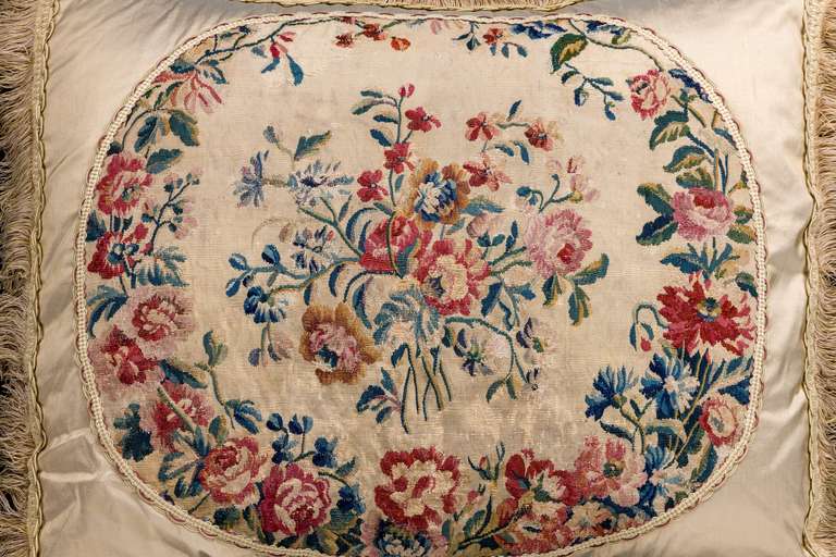 Gobelin, mid-18th century, wool with silk highlights. Vibrant flowers within a graduated outer border. Rich claret and greens.

RR.