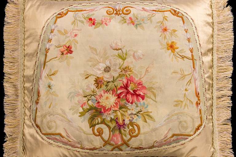 French, late 18th century tapestry weave in wool and silk. A bouquet of flowers and foliage in a continuous border. Very muted and gentle colors.

RR.