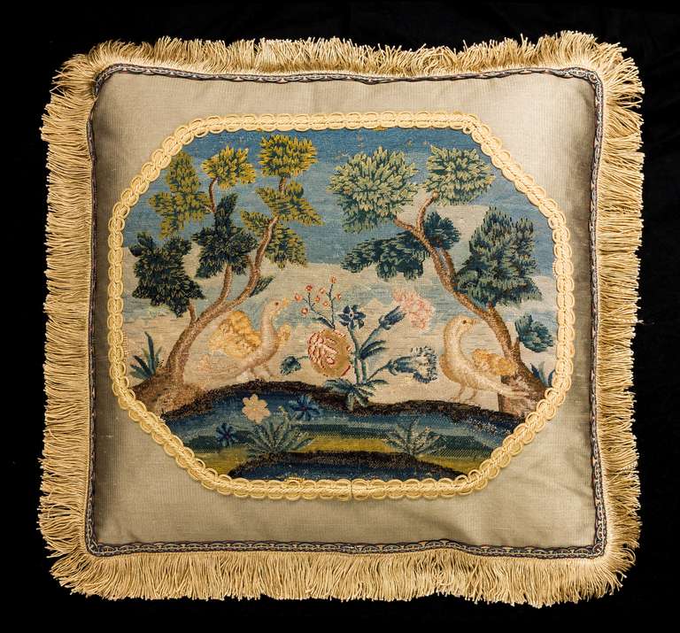 Mid-18th century, English or French, wool. Embroidered wool with silk highlights. Exotic birds within a framework of foliage.

RR.