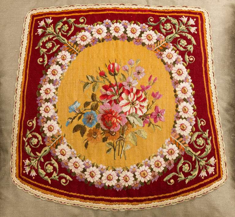 English or French, wool and silk, late 18th century. Flowers within a continuous border. The central background of gold within a vibrant claret outer border.

En suite with item: 5557.

RR