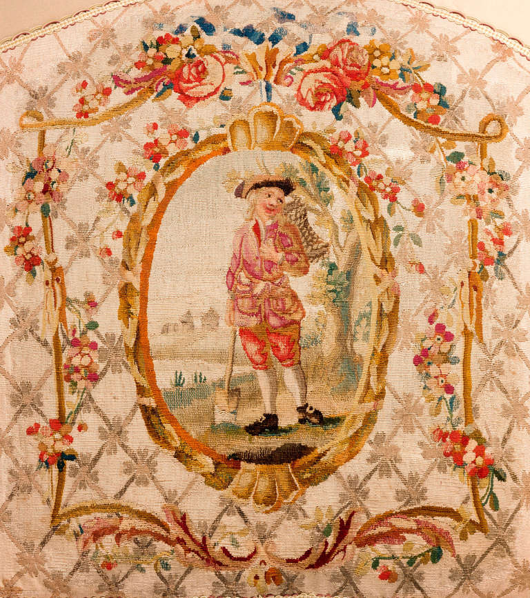 Mid-18th century, fine tapestry weave, silk. A gardener within a central panel, the surround of trellis with stylized boughs and foliage.

