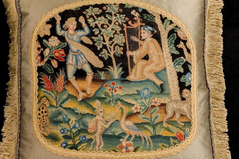 Early 18th century, French, gros and petit point wool cushion with silk highlights. Two figures wither side of a fruit tree. The foreground with a fabulous animal and bird. Good, vibrant colors.

RR.