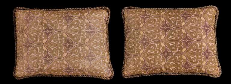 A pair of late 19th century, Ottoman, silk cushions with soft gilt thread on a flax background.