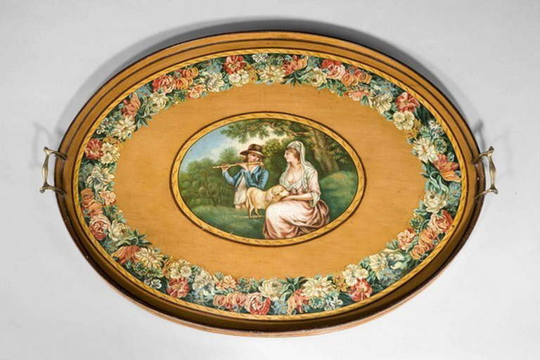 George III period pine tray, finely painted with borders of scrolls and flowers, the centre cartouche of a young man serenading a young lady, well painted and virtually original condition.

RR.