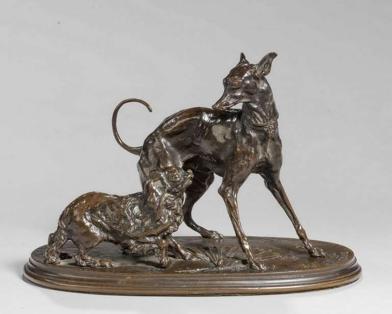 A well cast bronze 19th century group of a whippet and a pekingese after P J Mene, dark brown patina.

Provenance: 
Pierre Jules Mêne (25 March, 1810 – 20 May, 1879) was a French sculptor and animalière. Mene is considered the pioneer of animal