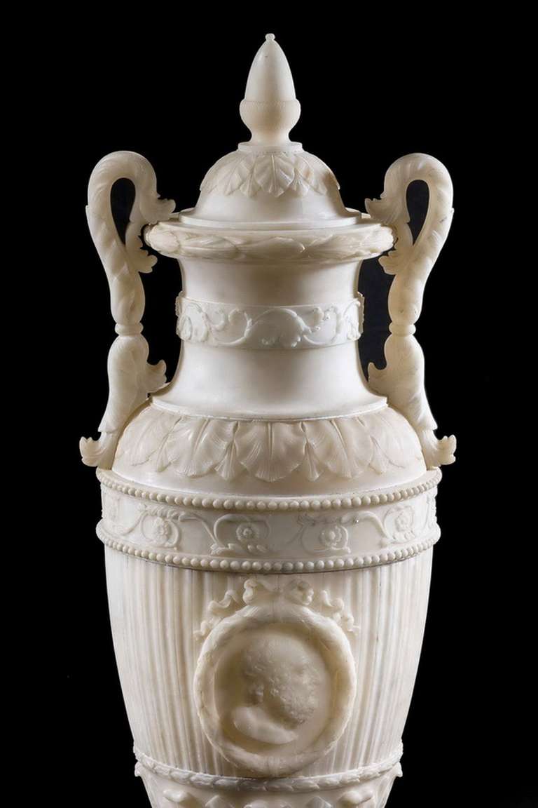 A massive 19th century alabaster vase of neoclassical form.

Provenance:
Alabaster is a name applied to varieties of two distinct minerals, when used as a material: Gypsum (a hydrous sulphate of calcium) and calcite, a carbonate of calcium, also