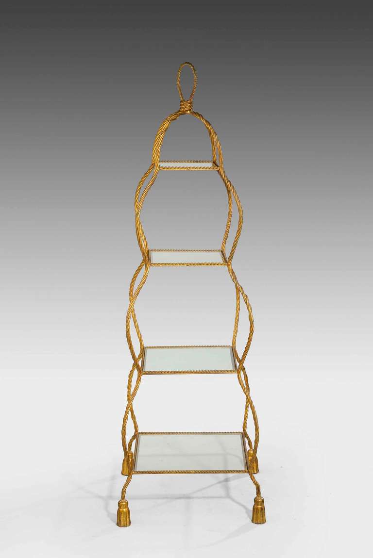 Early 20th century pretty and unusual French gilt bronze etagere, the frame and shell supports formed initially in a writhen gilt bronze. Overall fine lines.

RR.