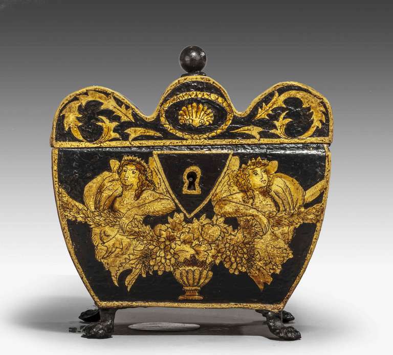 A charming Regency period Tole Ware Tea Caddy, the the gentle gilding decorated with figures, urns and scroll work, the interior retaining original tin lining.

In the collectibles and antique industry, Toleware refers to kitchen-related objects
