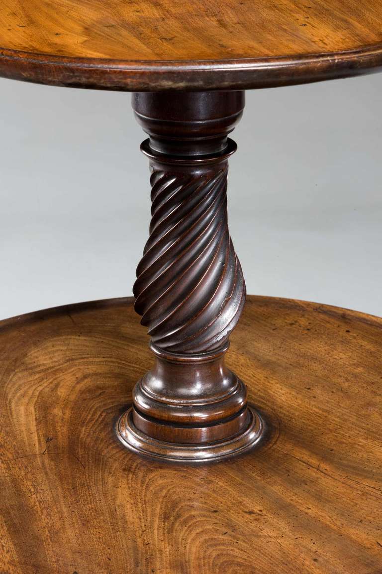A very fine Chippendale period mahogany 3 tier Dumb Waiter, the graduated writhen supports between three slightly dished trays, the cabriole supports carved with acanthus leaves and terminating in vigorously carved claw and ball feet.