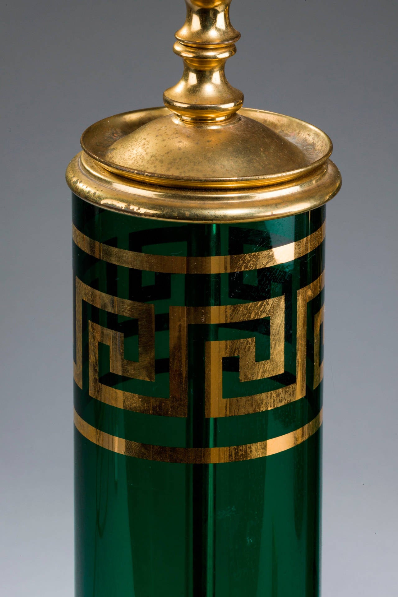 Pair of enamelled green glass lamps with Grecian key gilded decoration, original gilt metal mounts.

RR.
