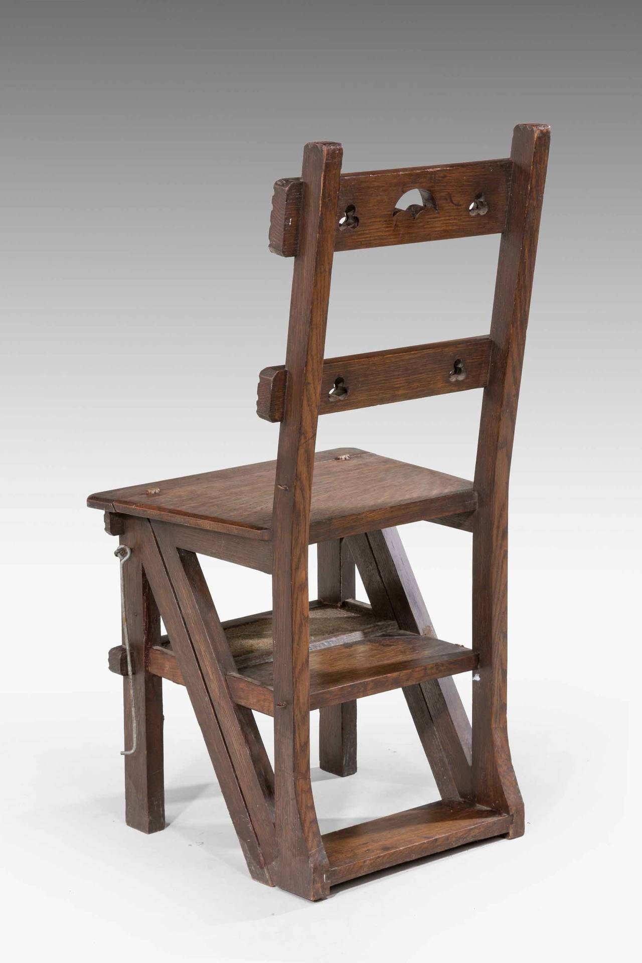 A 19th Century oak Folding Library Chair forming steps with original inset carpet sections.

RR