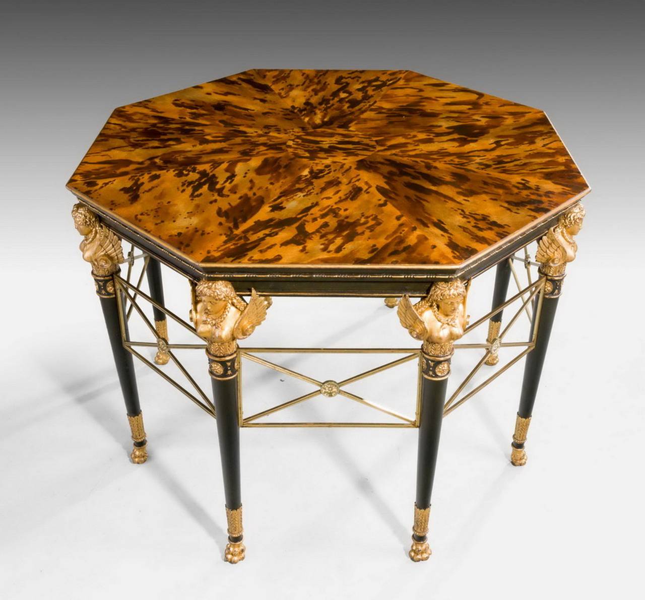 A fine and imposing 19th century giltwood faux bronze centre table, the supports with beautifully carved and winged busts, the centre section with gilt bronze mounts above faux tortoiseshell. The whole extremely elegant and formerly in the promenade