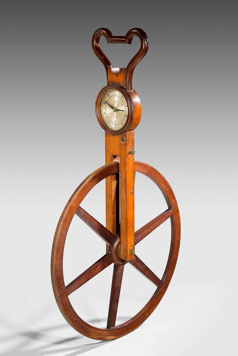 A W & S Jones Waywiser, English, first quarter of the 19th century. Signed to dial W & S Jones 30 Lower Holborn, London, with silvered dial divided for Furlongs and Miles, six-spoke wheel, mahogany fork body with shaped top and bar