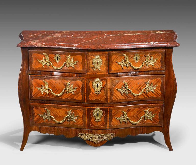 A good Louis XV Kingwood parquetry commode with particularly good bronze mounts. The mounts retaining their original gilding. Strong shape with attractively quartered and diamond in laid ends the leading edges crossbanded.