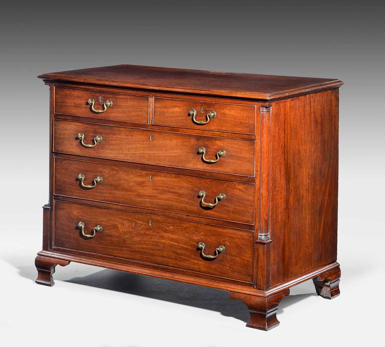 An attractive late 18th century mahogany chest of draws. With quartered canter’d corners on shaped ogog bracket feet and good period swan neck handles.