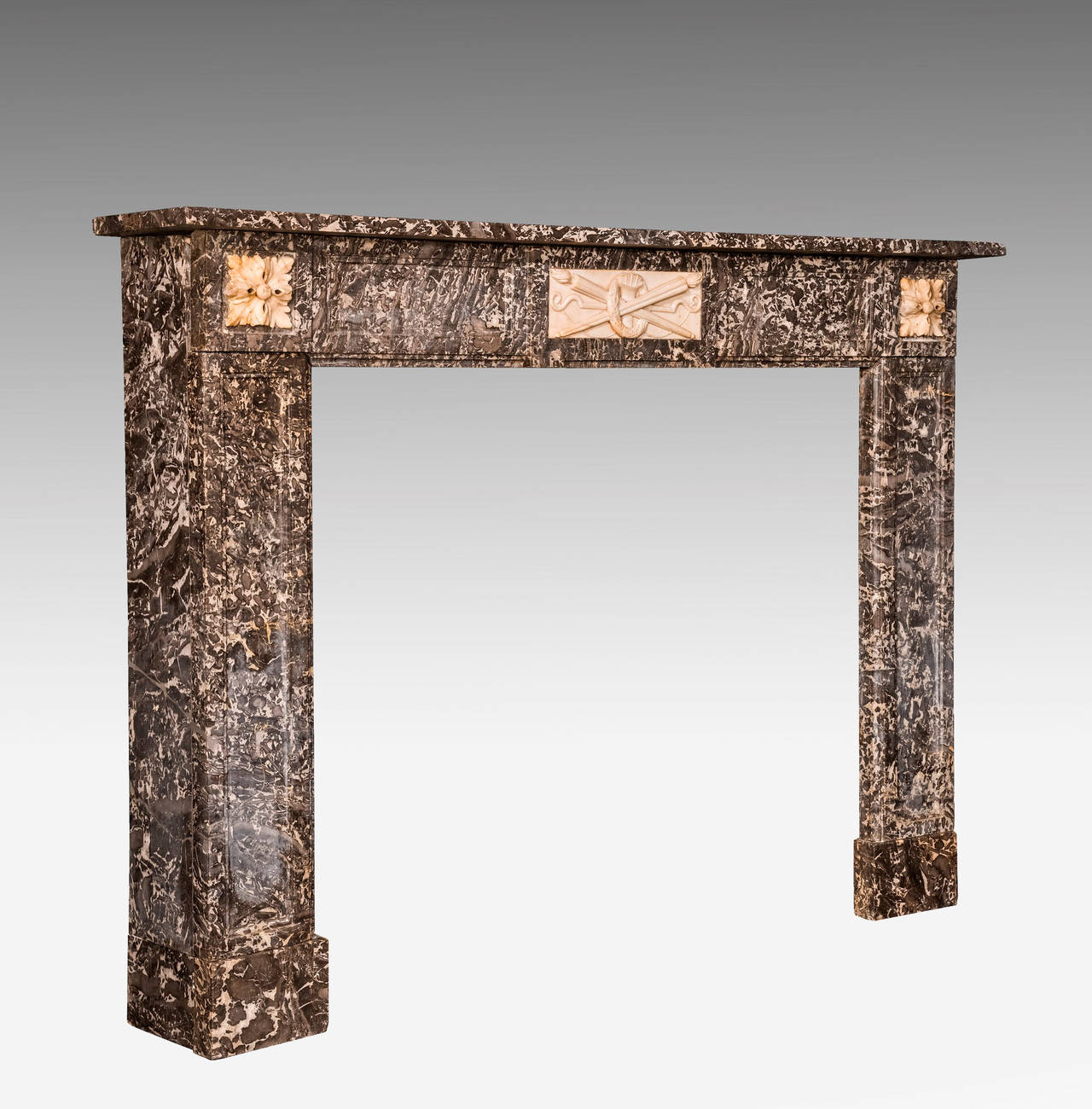 A very attractive Northern European highly figured grey marble fireplace, with white statue panels. Minor and old restorations to the uprights.

Shelf Length - 61.00 Inches 
Shelf Depth - 10.00 Inches 
Opening Height - 36.50 Inches 
Opening Width -