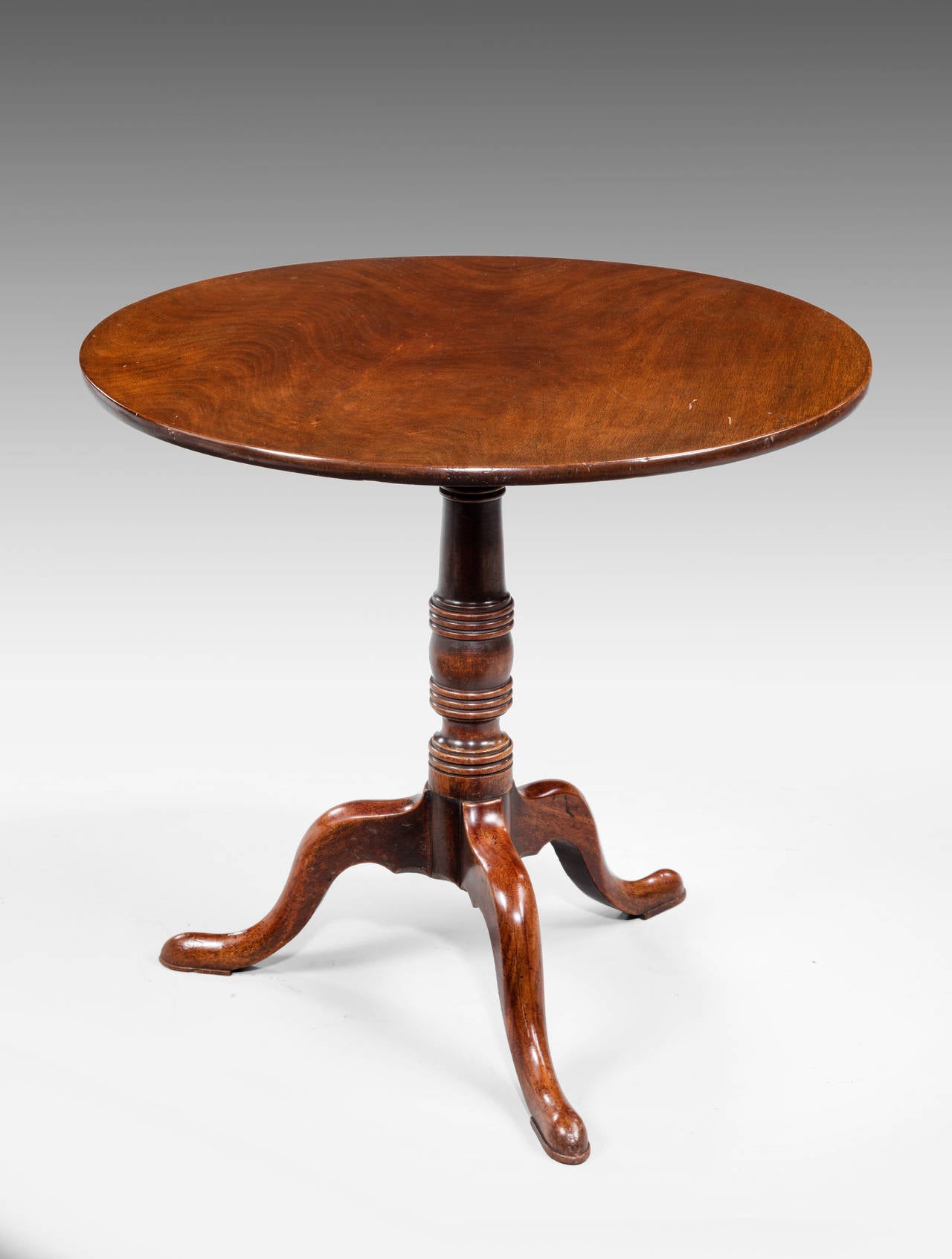A very well figured George III Period Mahogany Tilt Table, the central support with writhen sections, the top of very good colour and well figured.

RR