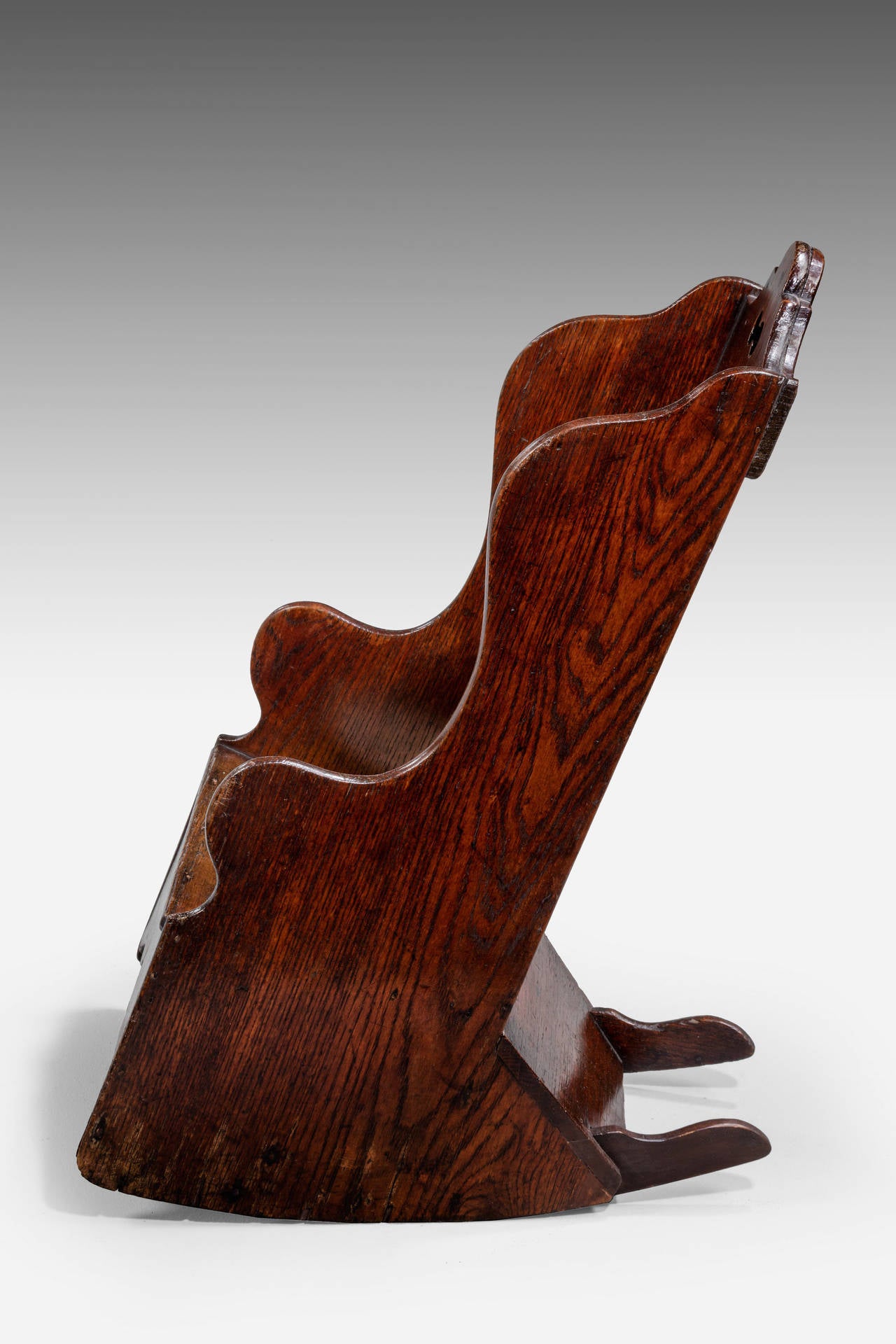 A charming oak child's rocking chair, incorporating period potty. Well figured timbers.

