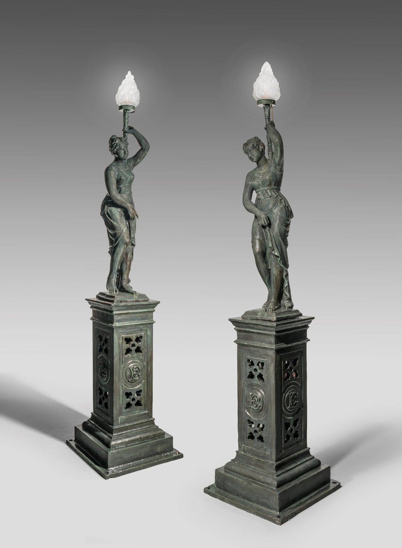 A most impressive pair of bronzed figures of young ladies, with a dark rich patina. Please note these figures weight approximately 300-400 kilos each.

