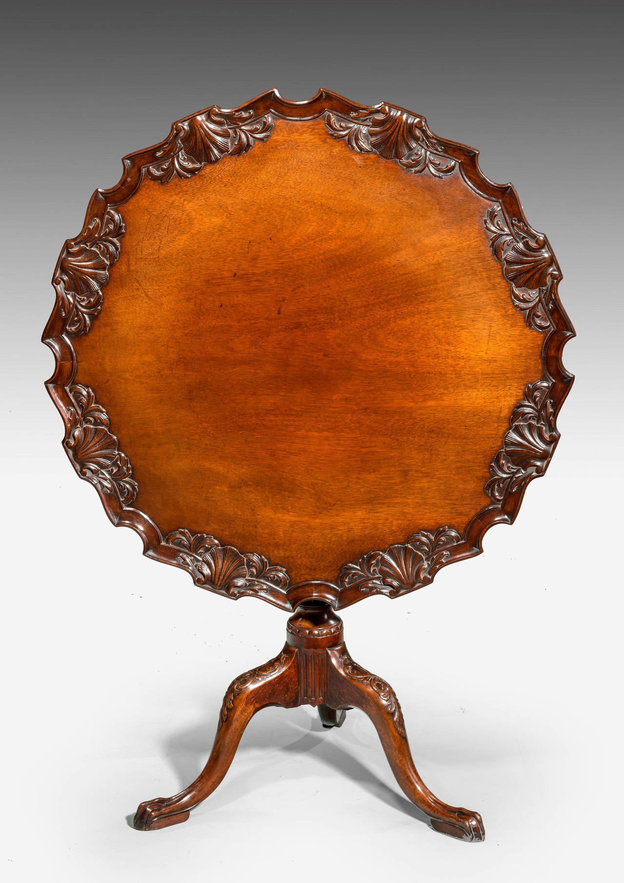 Chippendale design mahogany Dish Top Table ,the shaped dish top with shells and foliage. The carved central support over three well executed cabriole supports, stylistically eighteenth century.
