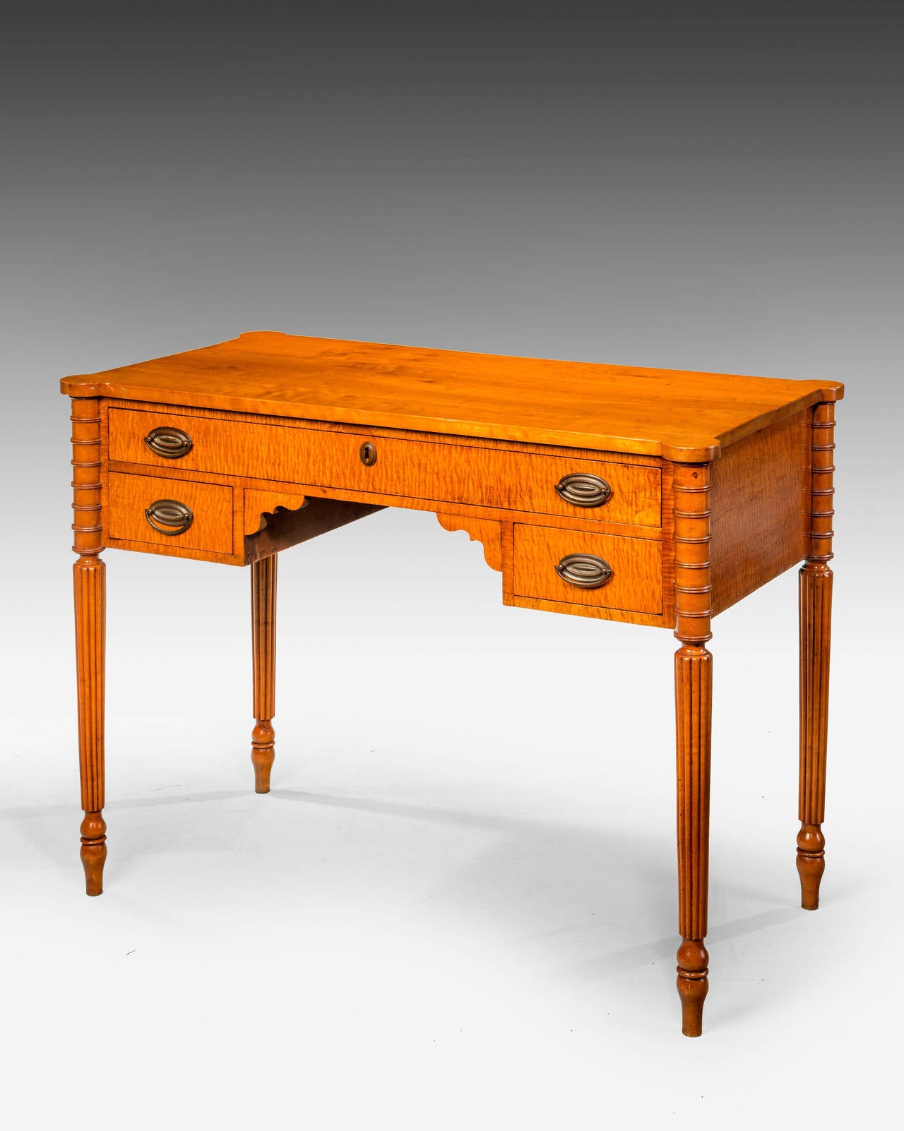 Late 19th Century Continental Satin-birch Side Table of delicate form. The freeze with three drawers over ring turned and reeded supports. Excellent overall colour and condition.

RR