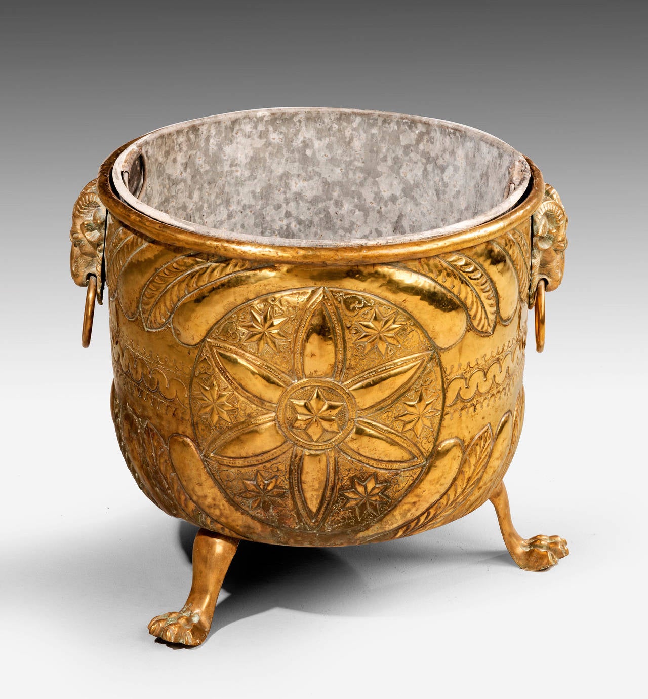 A very large and good Dutch brass container. With rams mount handles, on paw feet. The decoration strongly carried out with repousse work.