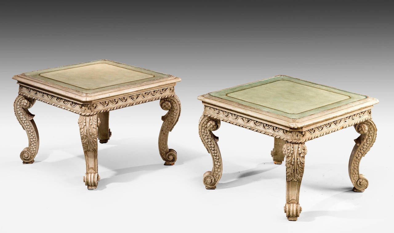 A good and well carved pair of low occasional tables. With soft dove grey colour, original paintwork, now somewhat tired with gilded decoration. On French scroll feet. Extremely well-constructed.

