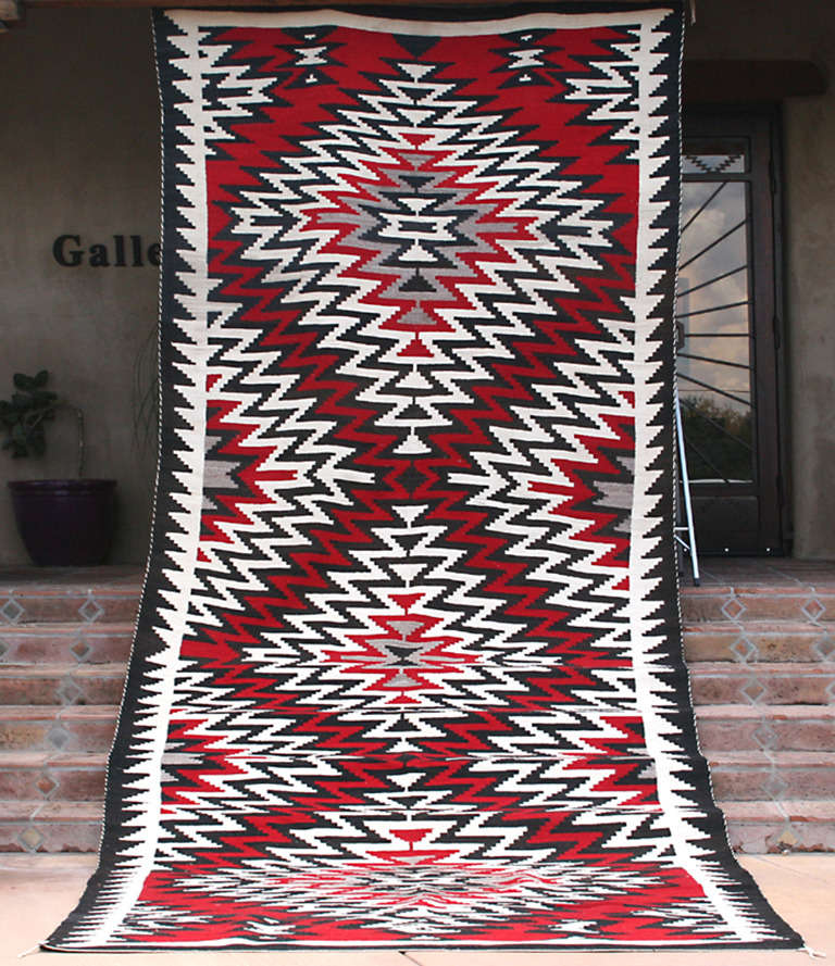 One of the largest Navajo rugs we have ever owned, all hand spun wool yarn, took well over a year to weave. Rug has virtually no wear, would make a great floor rug. The colors are vibrant.