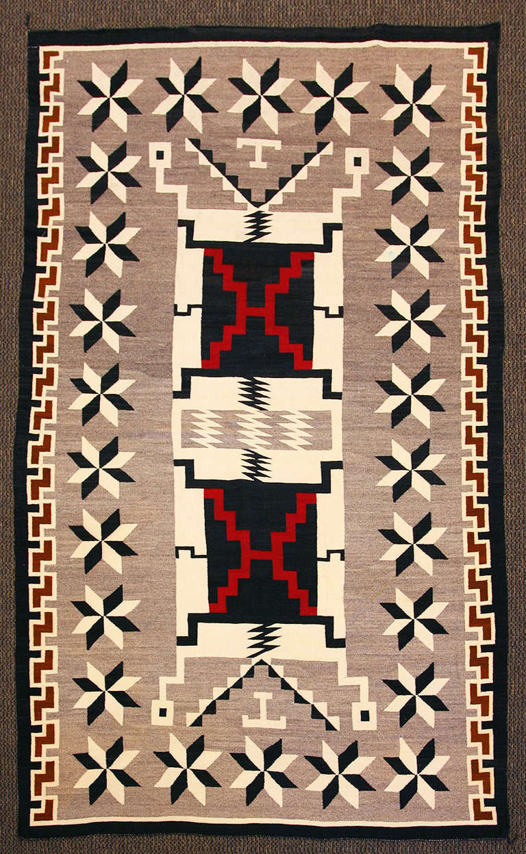 Tightly woven large Navajo rug from the crystal trading post region. This is a Classic storm pattern design. Wool is all handspun, natural browns and white colors.