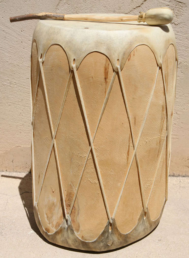 Hand carved Taos pueblo Cottonwood drum with leather drum coverings and hand carved tom tom