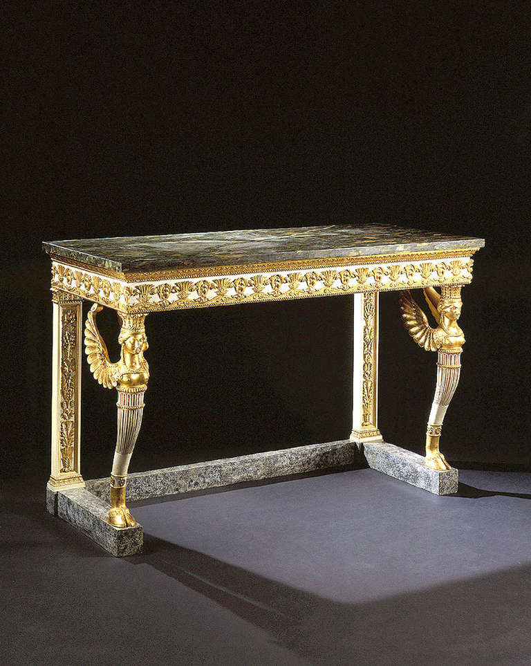 A Northern Italian Painted and Giltwood Console Table with Marble Top

PROVENANCE:
In a prominent Swiss Private Collection from 1860 to 1999.

The table, with a mottled dark grey marble top, bears a frieze of alternating foliate designs
