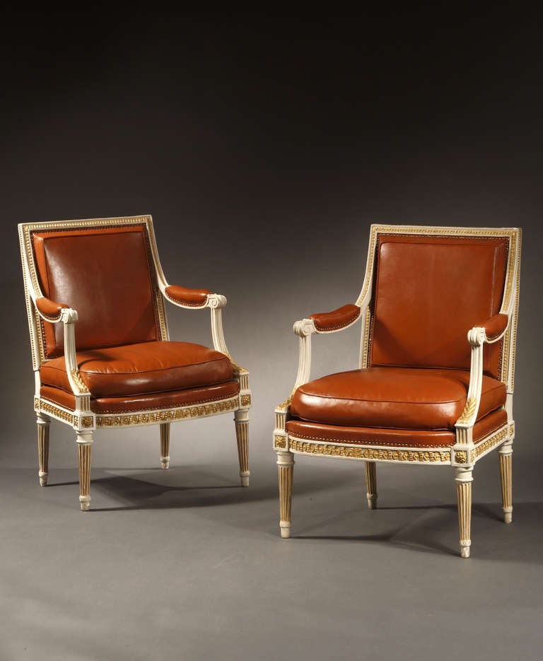 A Pair of Louis XVI Painted and Parcel Gilt Fauteuils
Stamped H. Jacob

Sold as pair, two pairs available

Provenance:  Partridge Fine Arts, London

Each fauteuil with a rectangular seat back, the crest rail carved with leaf tips and beading