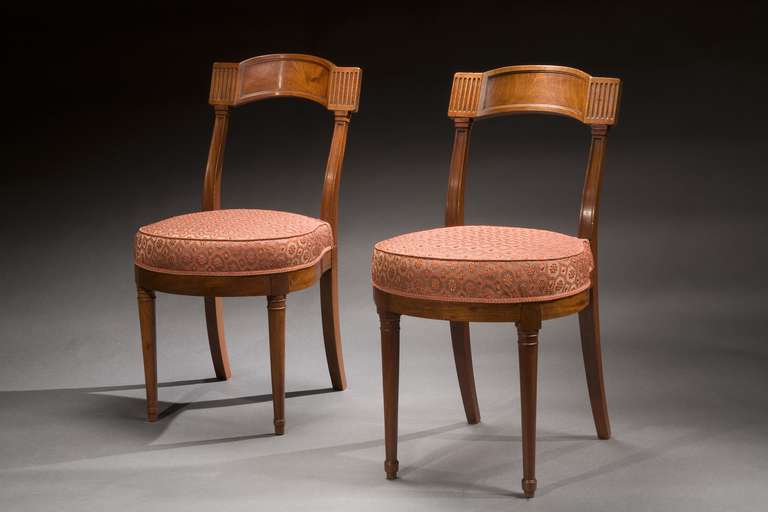 A pair of Directoire Chauffeuse beautifully carved and upholstered in horsehair.

Width: 13.5 inches
Depth: 16 inches
Height: 31 1/2 inches
Seat Height: 19.75 inches

Width: 13.75 inches
Depth: 16.5 inches
Height: 31.75inches
Seat Height: