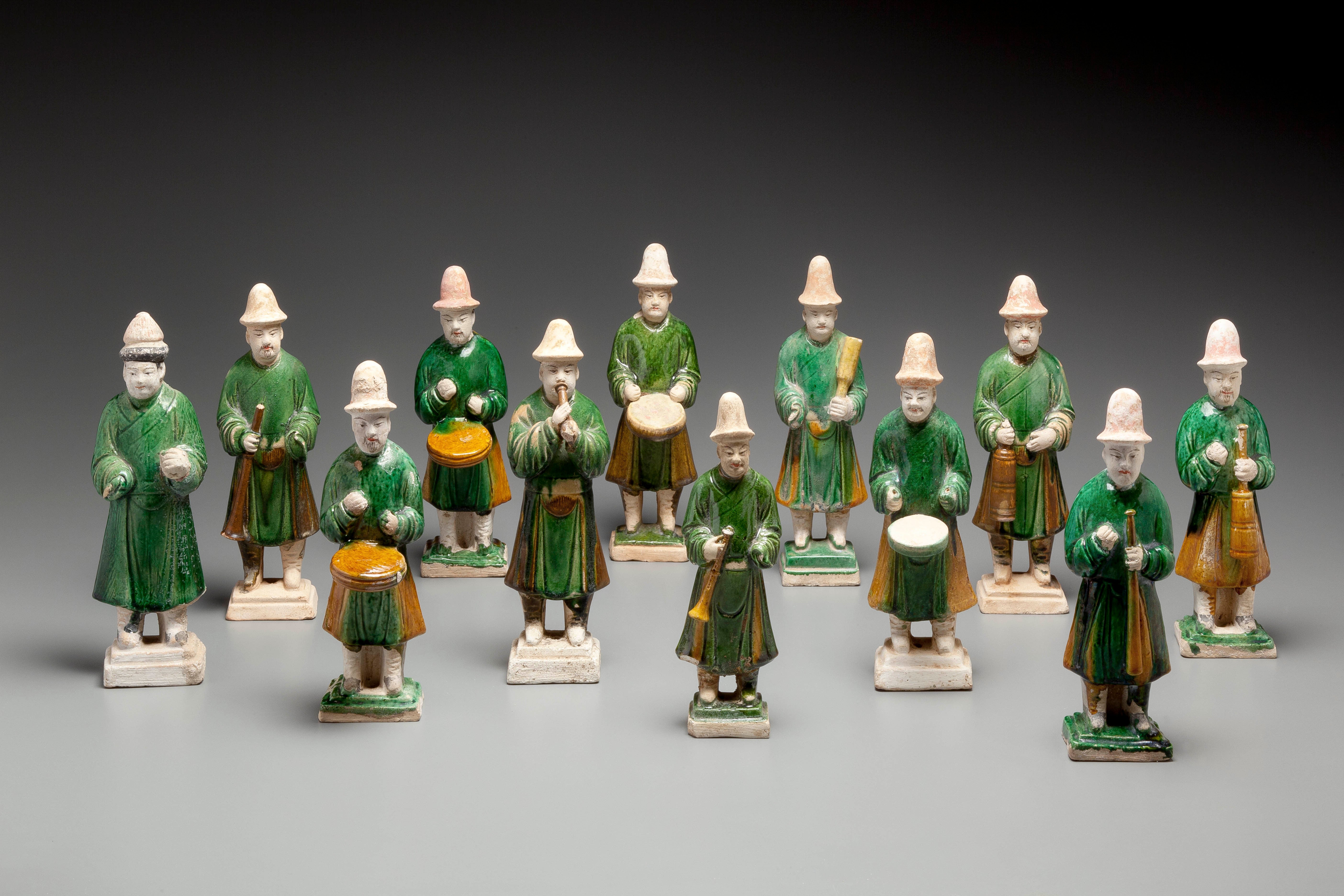 A Set of 12 Green Glazed Pottery Figures of Attendants and Musicians For Sale