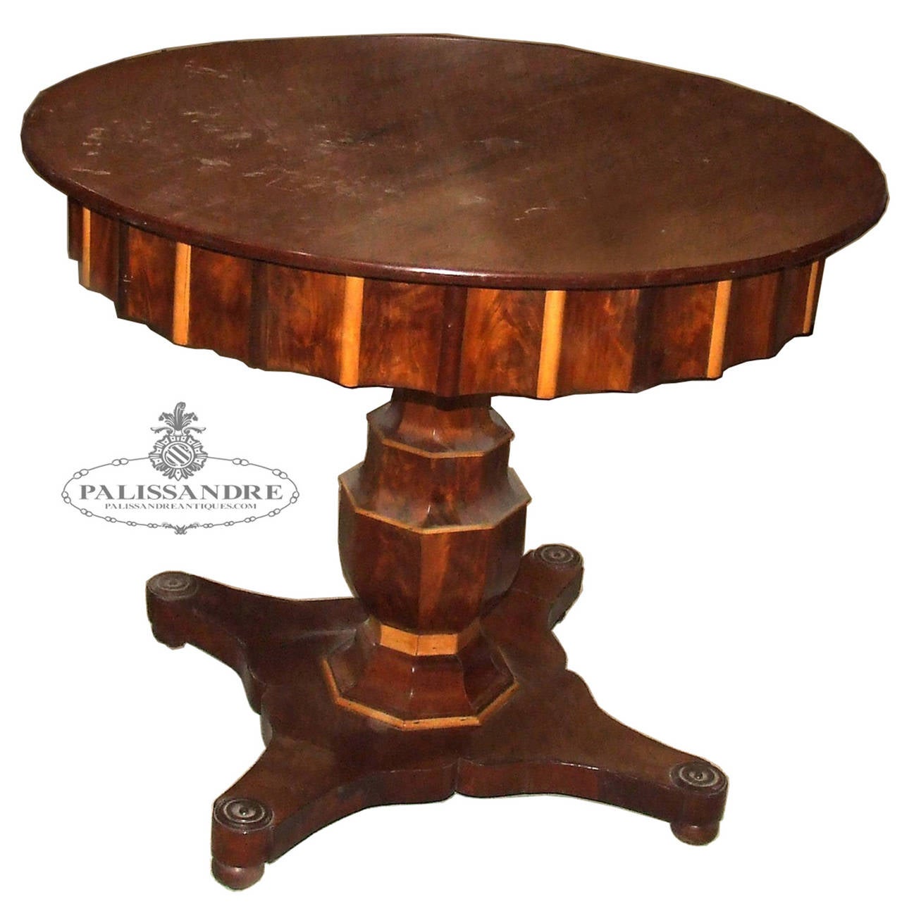 Beautiful table mahogany circular wooden stick in front of the structure that supports the board and foot single stand. Elizabethan style.