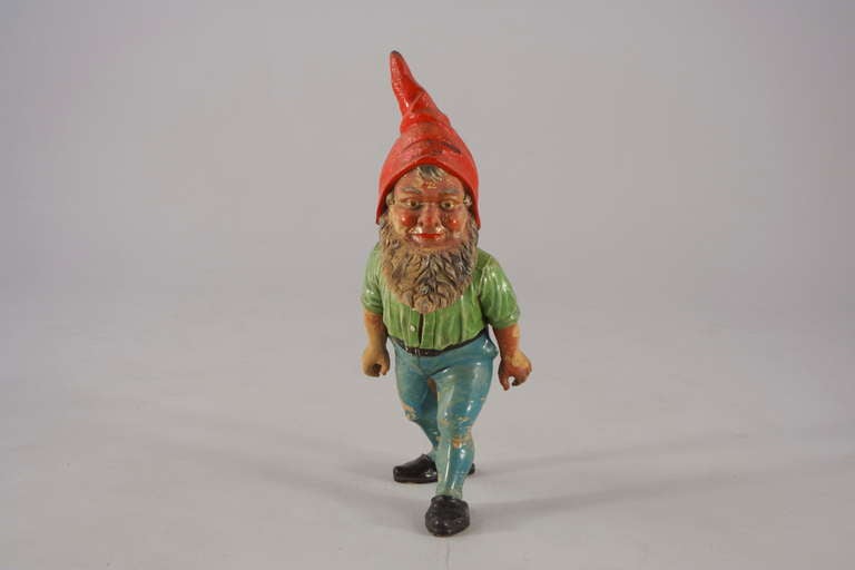 Very droll looking gnome with opened shimmy in huge size from Germany´s Bavarian countryside, feels good watching him under the fir tree. Made out of clay and colored friendly. Museum-like piece in good condition and a rare fragile image, few remain