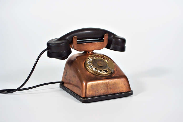 very heavy old telephone of copper and bakelite, well working