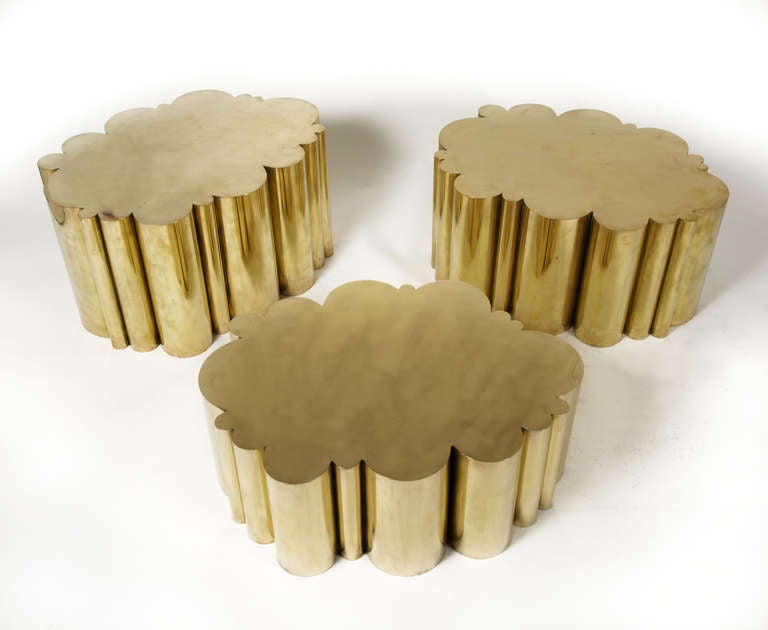 Cloud coffee tables in brass. Measure: Three different heights:
High H 36 cm, W 67 cm, D 51 cm.
Medium H 32 cm, W 67 cm, D 51 cm.
Low H 26 cm, W 67 cm, D 51 cm.
New edition of 25 pieces for each size.
The tables can be sold as a set or