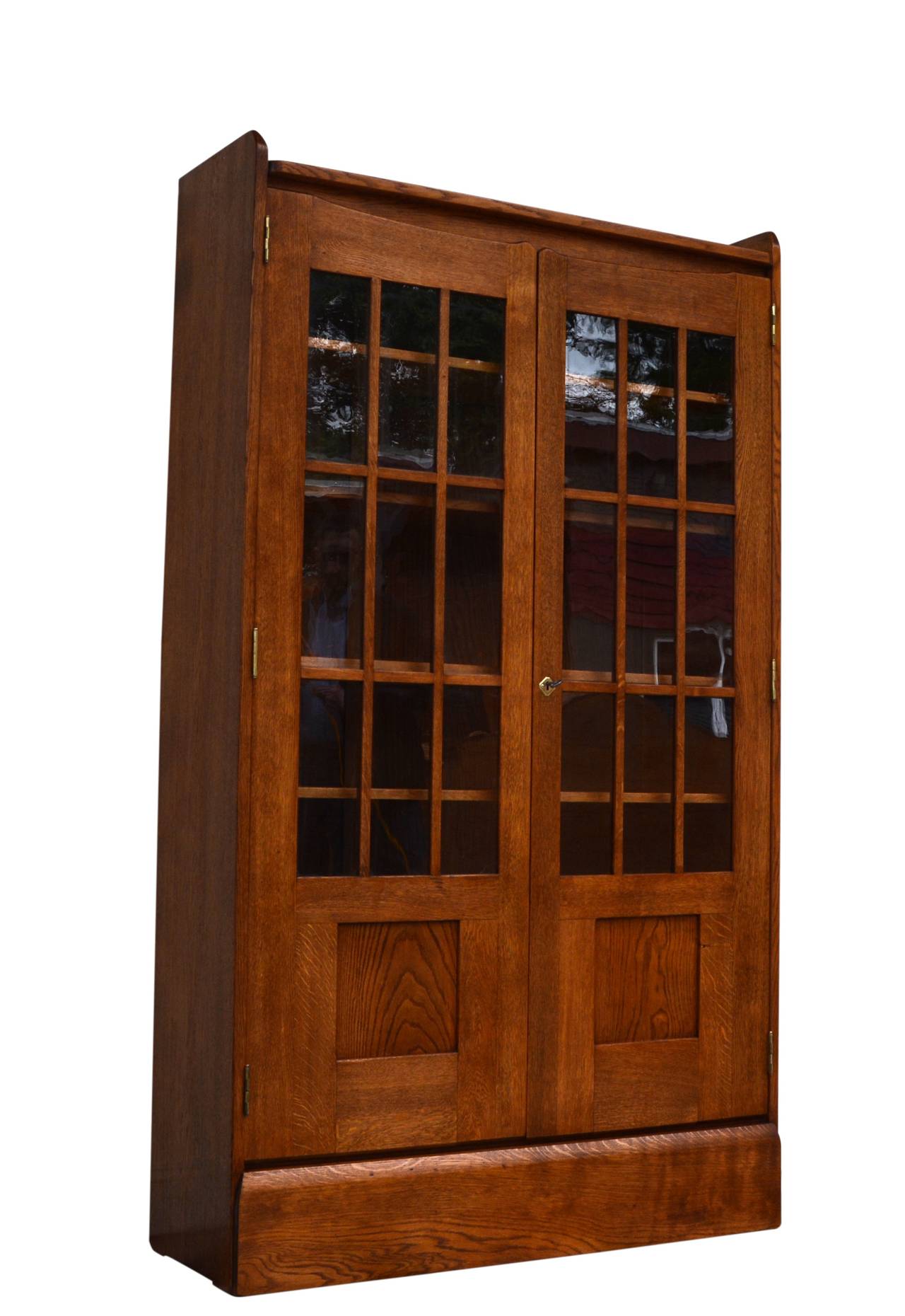 Richard Riemerschmid Glass Cabinet from 1905. 

Very rare Art Nouveau object of museum quality. Made of solid oak wood. It features coffered doors and latticed windows.

The locks and fittings are made of polished brass and are originals. The