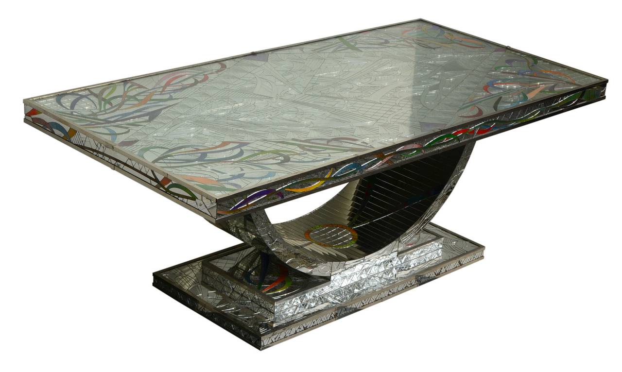 Extravagant dining table by renowned French designer Daniel Clément, 1970s.

Layered pedestal, semicircular base. Spacious rectangular tabletop with a stainless metal frame. Completely ornamented with mirror glass and stained glass.

The