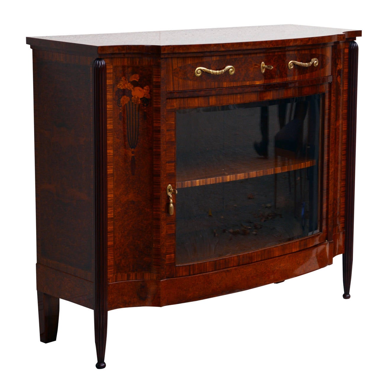 Exceptional Art Déco Period Sideboard, Paris, 1920s. Made of walnut, rosewood, and other precious wood. 

Concave sides, very detailed intricate marquetry, glass door with cut glass.

This sideboard is attributed to French master designer Paul